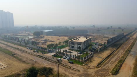 aerial drone shot capturing a massive construction site ace terra in sector 22d in noida india