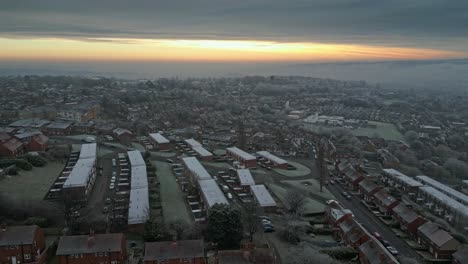 cinematic aerial footage, depicting harsh winter cold spell with mist and freezing temperatures