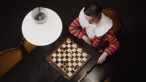 woman playing chess