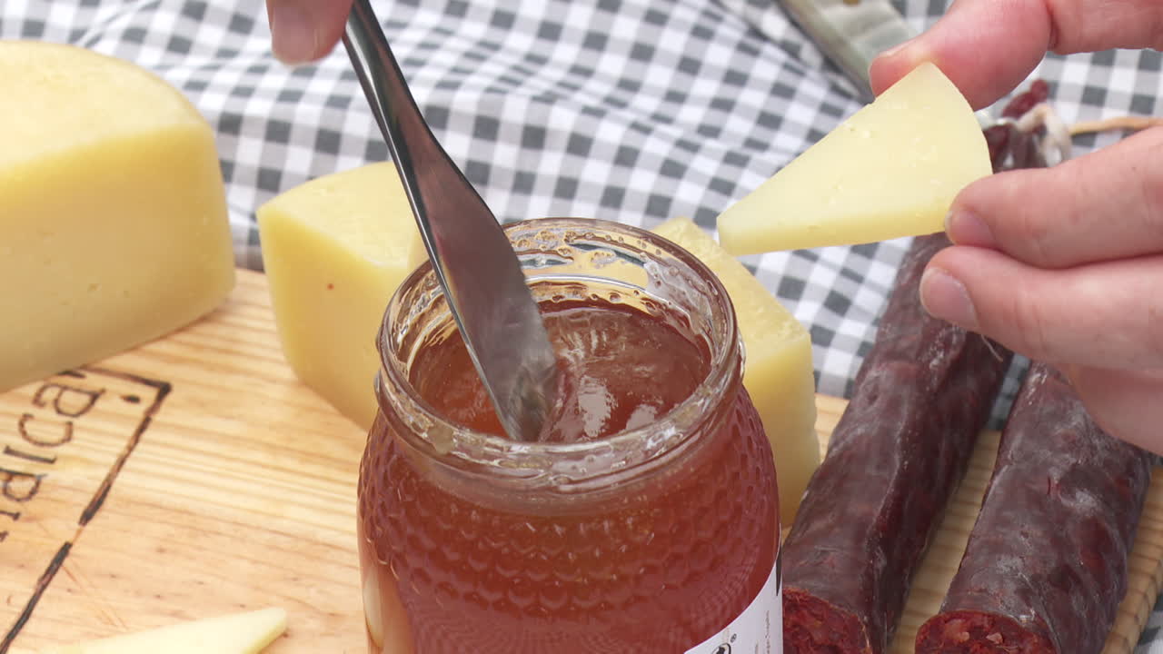 Tasting cheese with honey and jam