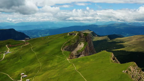 wide aerial pan around val gardena, dolomites in italy