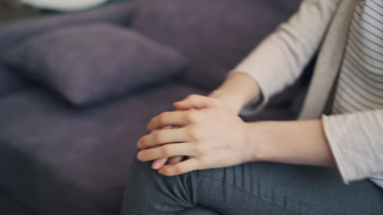 Woman sitting and interacting.
