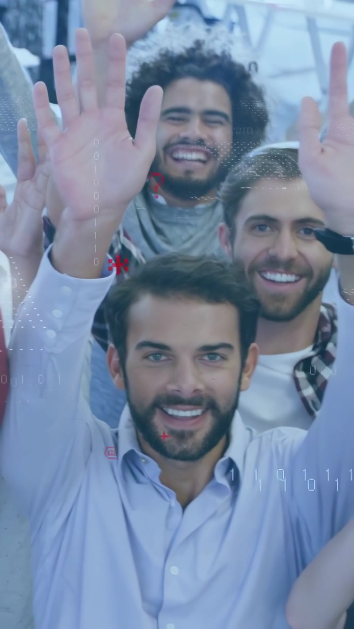 Vertical video: Team waving at camera in office while camera rising, red binary icons overlaying