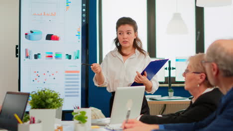 Young-businesswoman-coach-leader-conference-speaker-giving-business-presentation