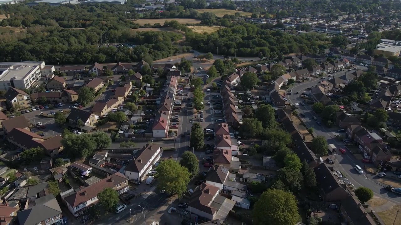 Cinematic aerial view of Uxbridge with sweeping footage across residential areas and town centre buildings. This perspective showcases suburban architecture, transport links, and the everyday rhythm.