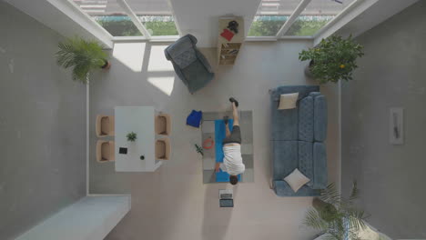 man exercising in living room