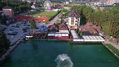drone shot oi lake in downtown zlatibor mountain resort serbia on sunny summer day