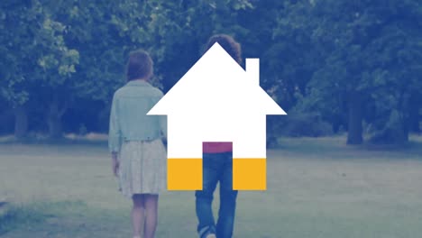 young couple walking outdoors and house icon filling with yellow