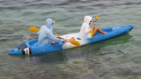 couple kayaking in calm waters