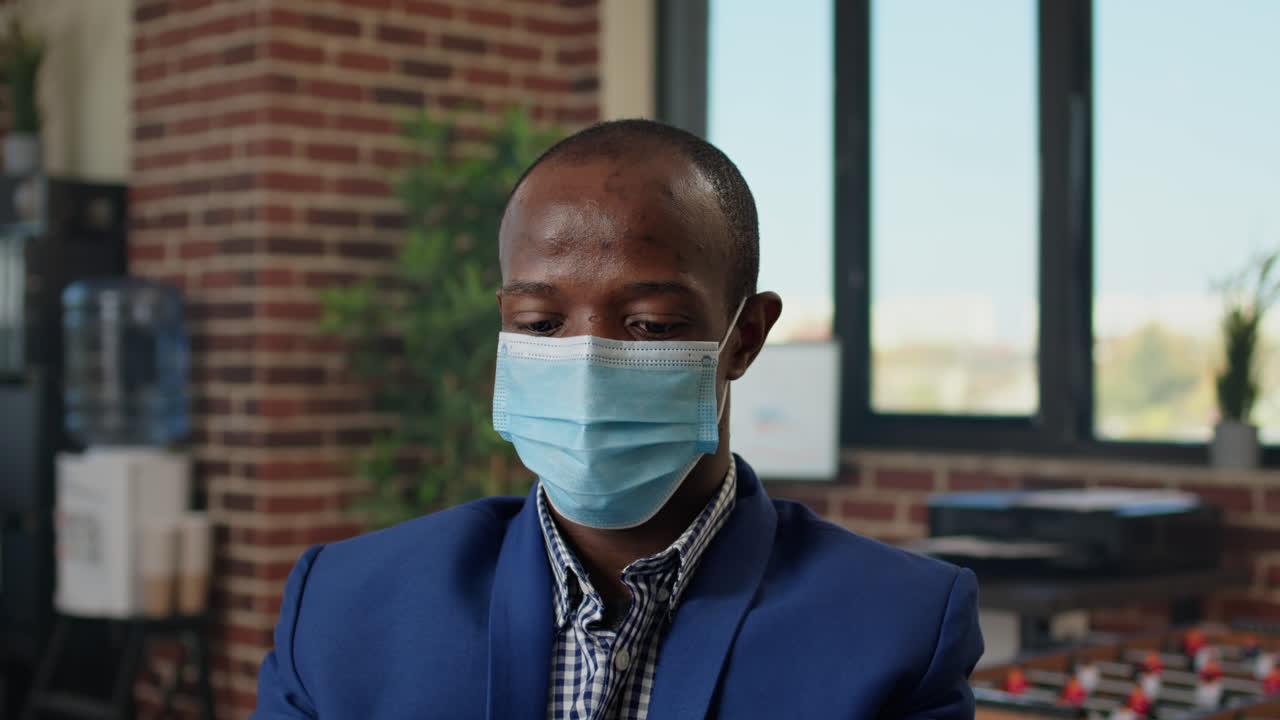 Company employee analyzing financial statistics on laptop
