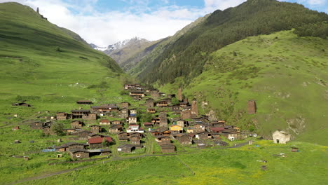 rotating drone shot of dartlo village in tusheti georgia with medieval combat towers