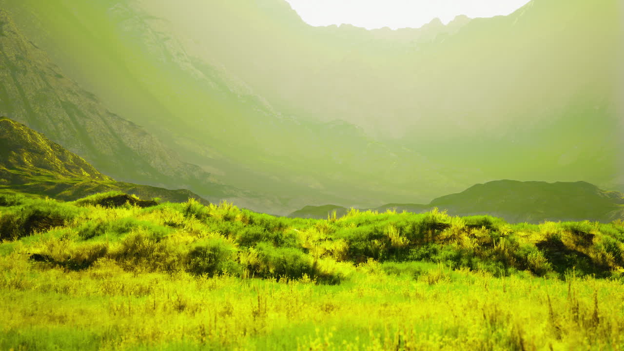 Vibrant green landscape with hills and mountains under bright sunlight