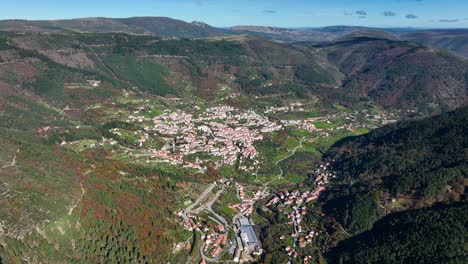 high angle drone view of manteigas village in valley, serra da estrela, portugal