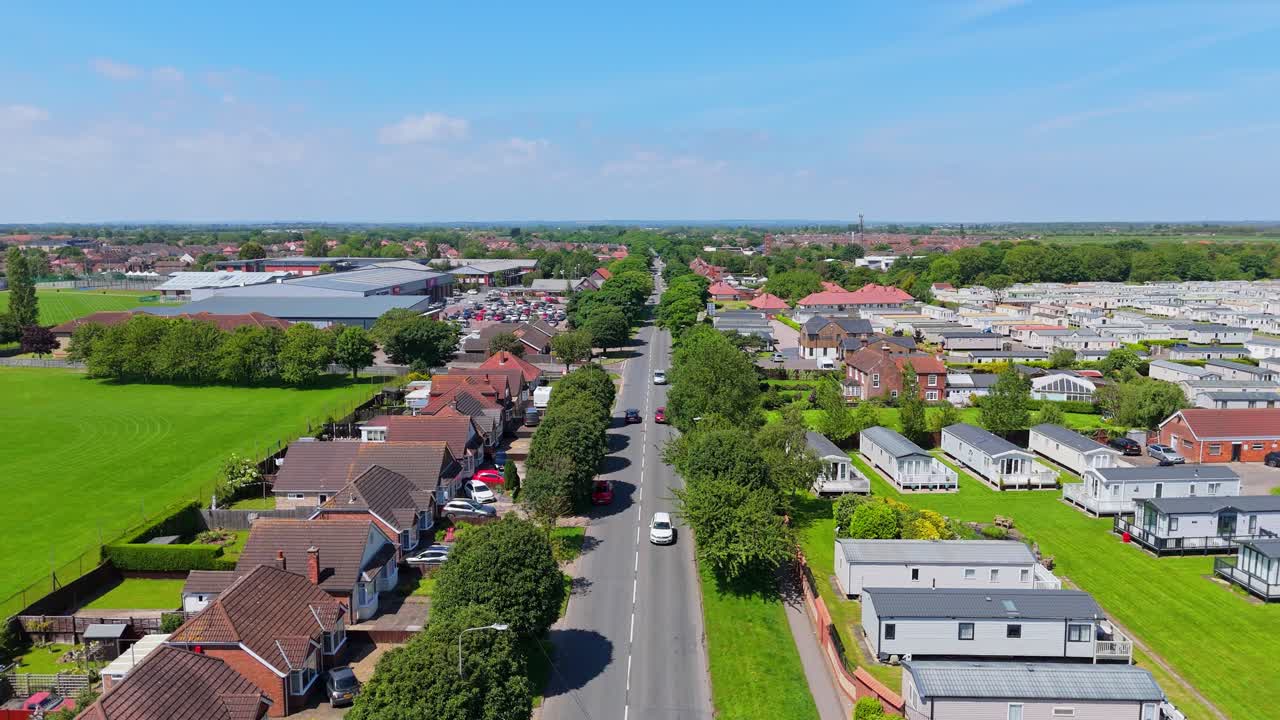 Aerial View of a Residential Road with Houses and Mobile Homes