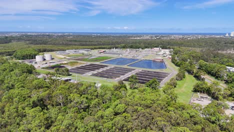 drone captures wastewater facility in lush forest setting