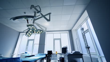 apparatuses standing close to the operational table in surgery room. technological equipment prepared for vascular surgery in empty ward.