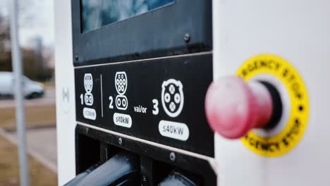 camera slowly pulls away revealing ev charger details in subtle hand motion