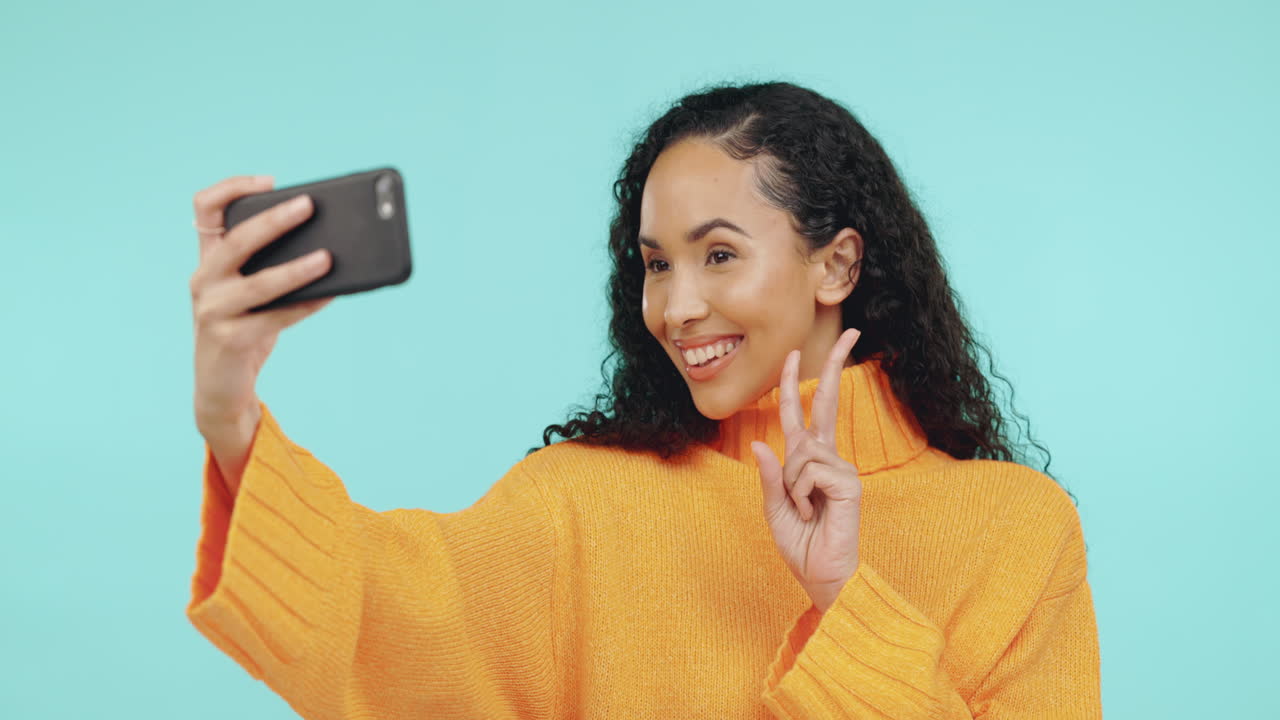 Selfie, pose and black woman with phone in studio