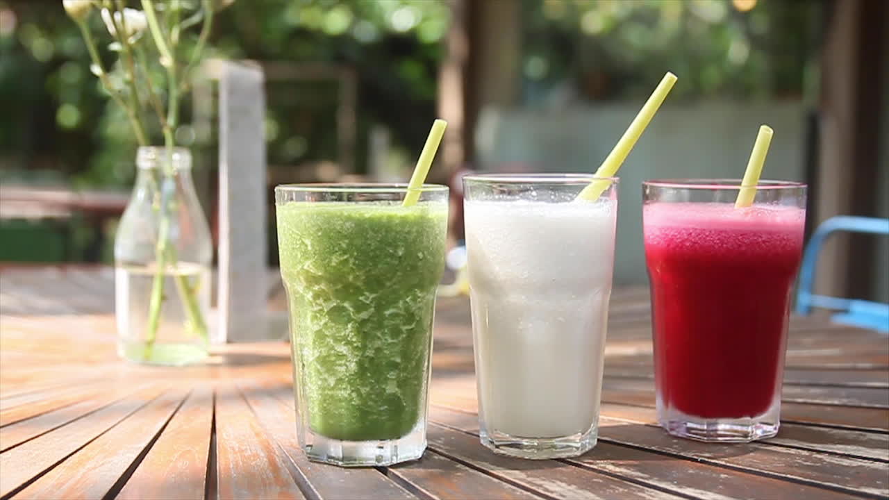 Rack Focus on Three Colorful Healthy Juice Smoothies