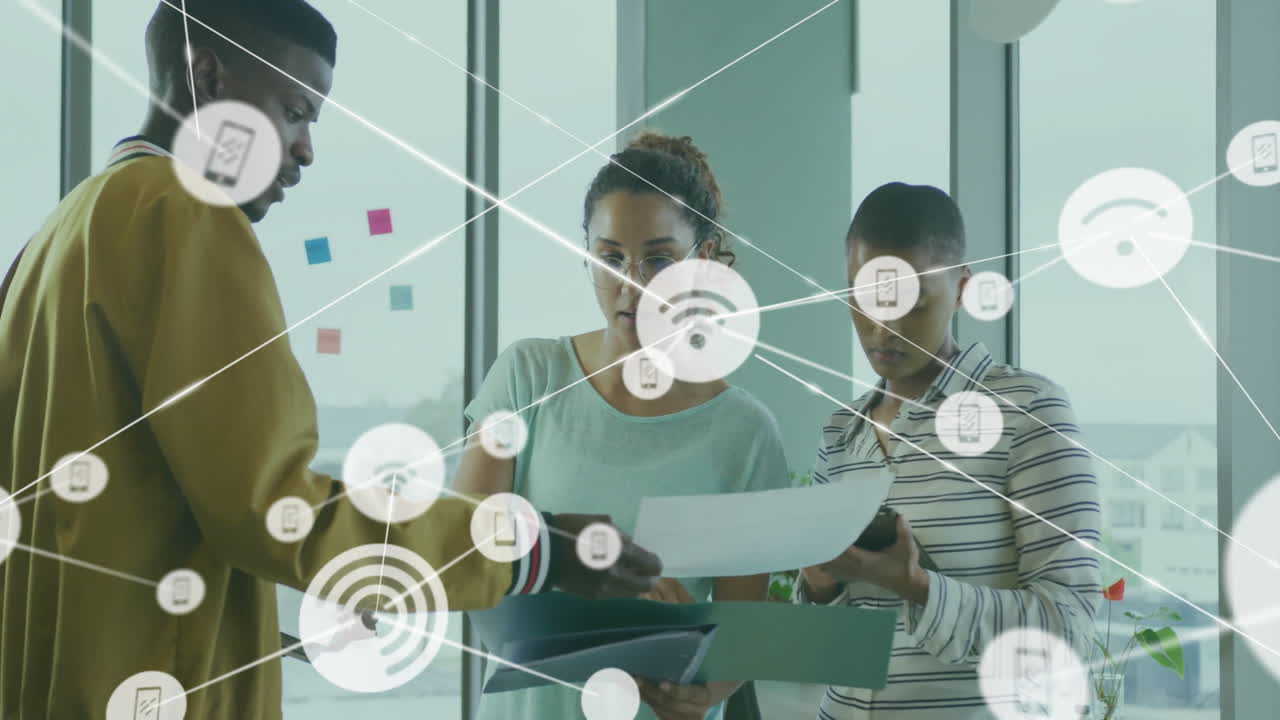 Animation of network of connections with wifi icons over diverse business people in office