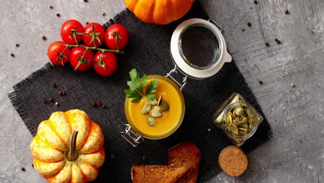 pumpkin soup with bread and vegetables