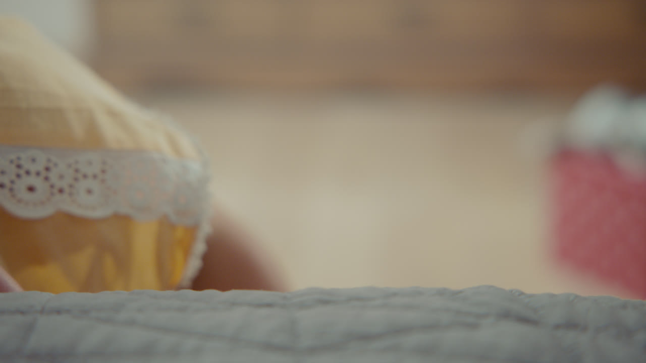 A girl playing with dolls in her room