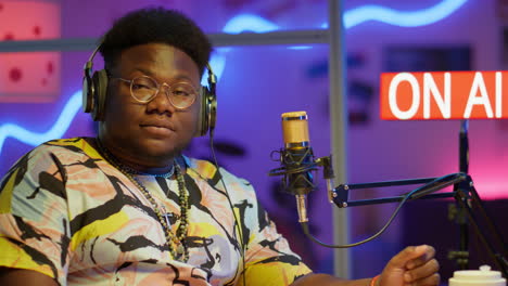 man broadcasting in a radio studio