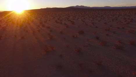 A-beautiful-fast-moving-low-aerial-over-the-Mojave-desert-at-sunrise-or-sunset-3