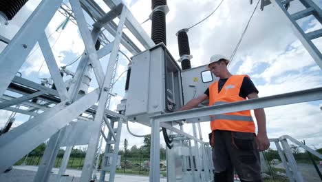 electrical engineers inspect the electrical systems at the equipment control cabinet