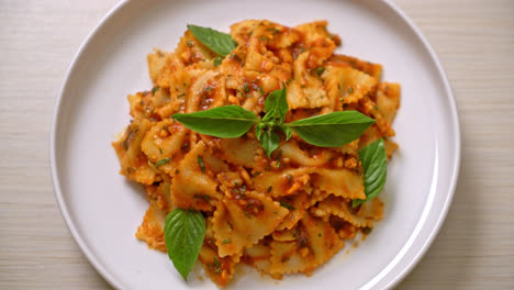 farfalle-pasta-with-basil-and-garlic-in-tomato-sauce---Italian-food-style