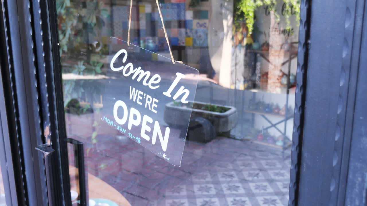Open sign on a store door