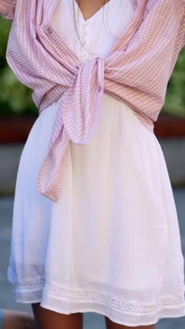 woman in a pink and white plaid shirt dress