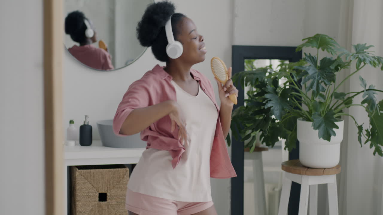 Woman Singing and Dancing in Bathroom