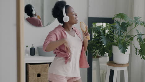 woman singing and dancing in bathroom