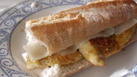 Delicious chicken bocadillo sandwich on a plate, homemade comfort food vibe