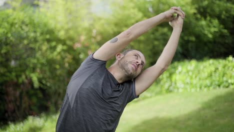 Man-practicing-yoga-in-mat