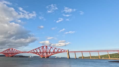 clouds moving over forth bridge in edinburgh