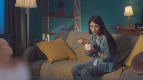 woman enjoying ice cream at home