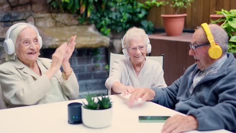 seniors enjoying music with headphones