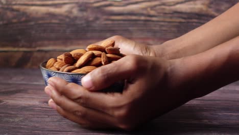 Almonds in a Bowl Held by Hands