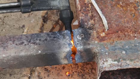 welding repair of rusty metal beam