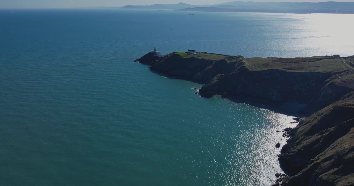 A 4K pullback shot of the Bailey Lighthouse peninsula Howth Dublin Ireland