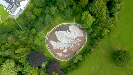 aerial drone rotating vertical ascent over the great polish map of scotland at the village of eddleston, scottish borders