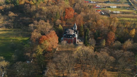 historic building of ghica castle during autumn in dofteana, romania. - aerial shot