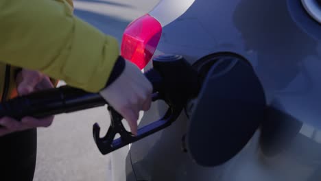 talent starts fueling the car's tank, iceland