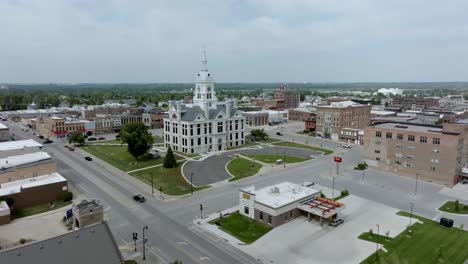 Marshall-County-historic-courthouse-in-Marshalltown,-Iowa-with-drone-video-moving-in-at-an-angle