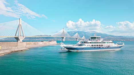 ferry approaching rio-antirrio bridge in greece