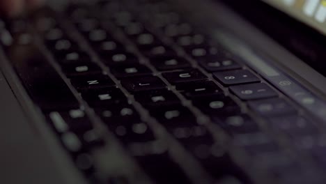 worker typing on a apple macbook pro laptop in the business workplace. digital online technology.