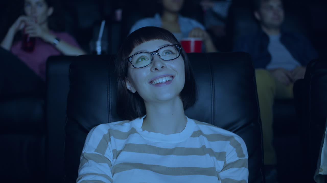 Woman Laughing in a Movie Theater