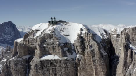 snowy alpine peak with mountain hut